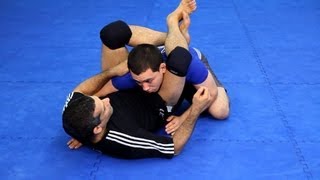 How to Do the Triangle Choke  MMA Fighting [upl. by Drawdesemaj46]