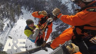 Rescue Cam Snowmobiler with Broken Leg Airlifted to Safety  AampE [upl. by Nagek]