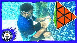 Most Pyraminx Rubiks Cubes solved underwater  Guinness World Records [upl. by Pip]