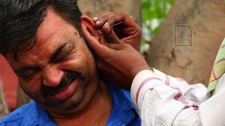 Ear Waxing  Traditional ear cleaner in India [upl. by Adore280]